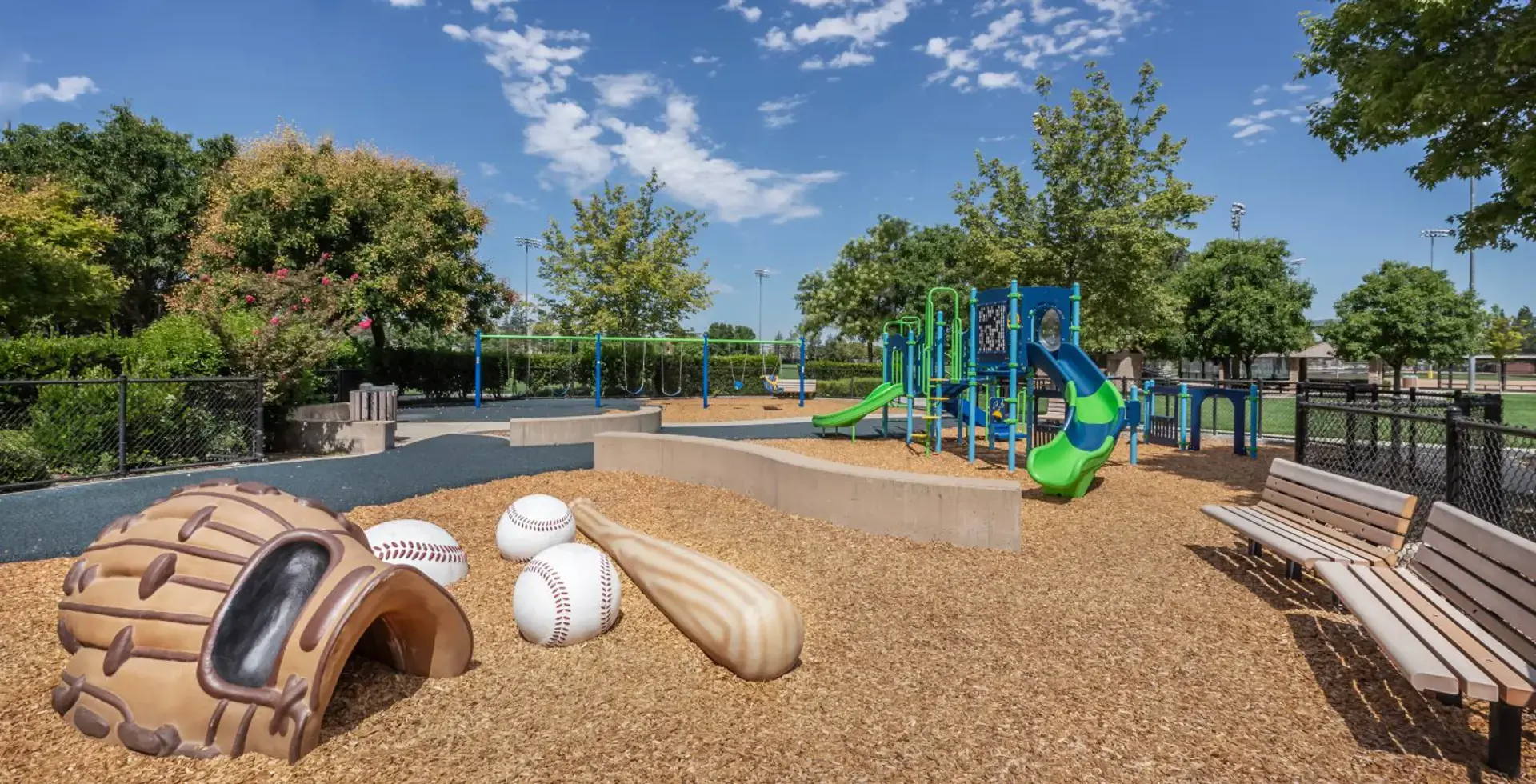 Community park with a baseball-themed playground near the home